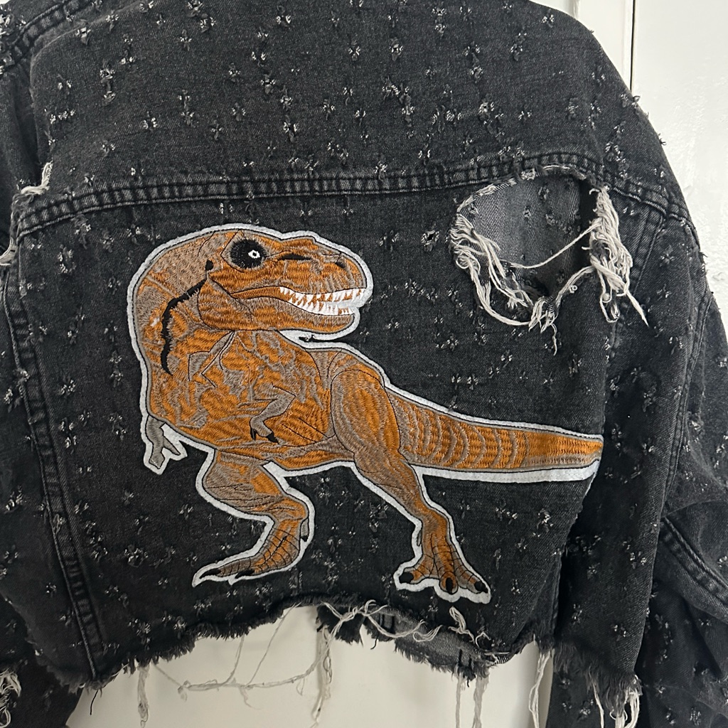 Distressed Black Denim Jacket With Dinosaur Patchwork